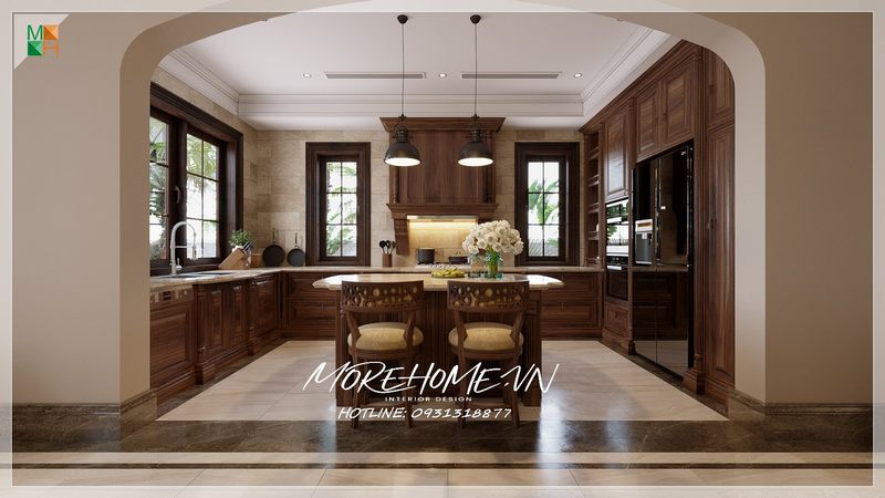 Tủ bếp chữ L gỗ óc chó mặt đá trắng tân cổ điển liền tủ rượu tổng thể gọn gàng ngăn nắp sử dụng tiện nghi thoải mái cho quá trình nấu nướng hằng ngày.